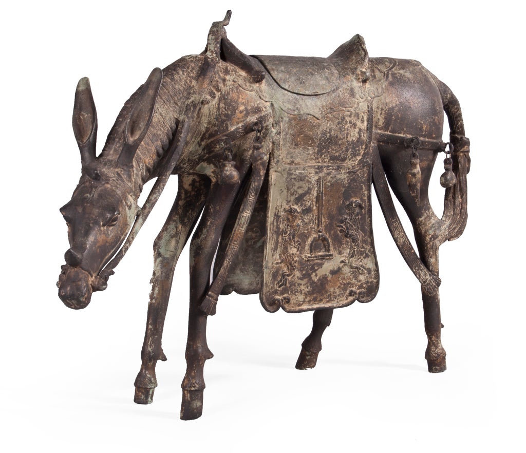Cast bronze sculpture of Mongolian Mule in full travelers garb. Detachable saddle reveals hidden storage.