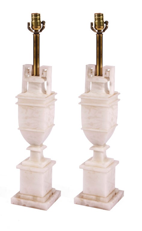 Pair of urn shaped alabaster lamps with Greek Key handles in the classical tast on disk base. Priced per pair.