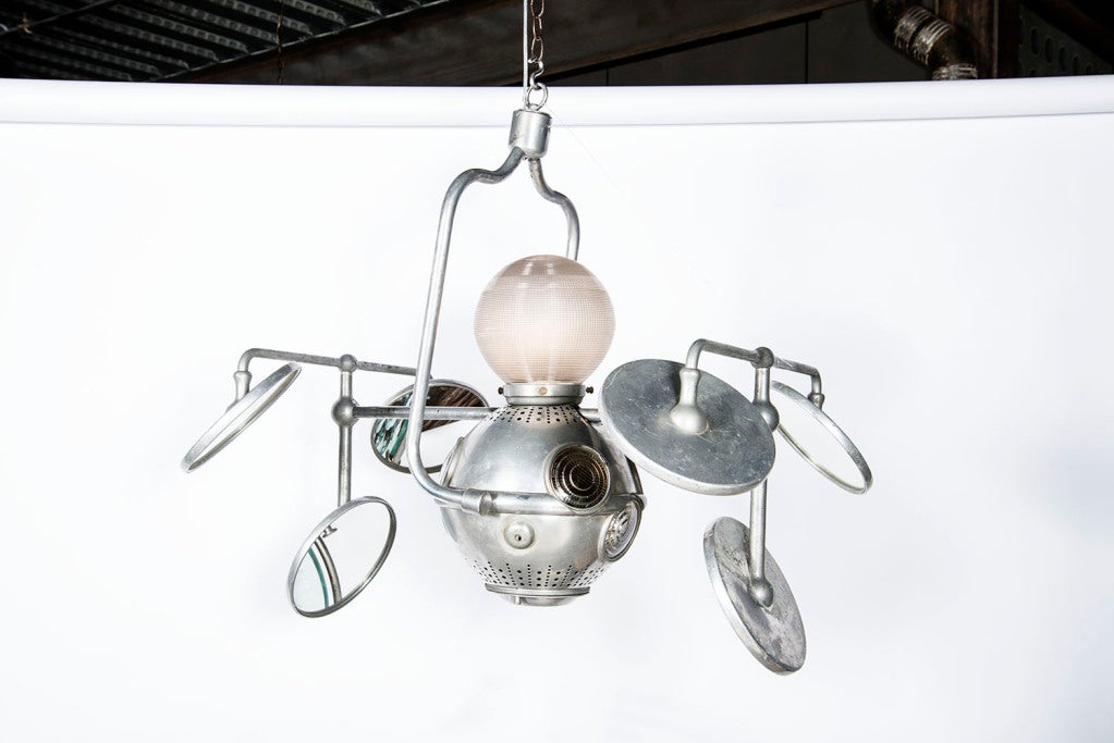 Stainless steel and aluminum multi armed surgical pendant with adjustable mirrors, internal ambient light and external top globe bulb lamp with glass cover.

All Sales Final - No Additional Discount.
