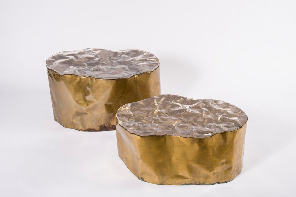 Pair of brass hammered sheet metal wrapped around wooden base with form fit cast clear lucite molded tops. Individually priced. Pair available.