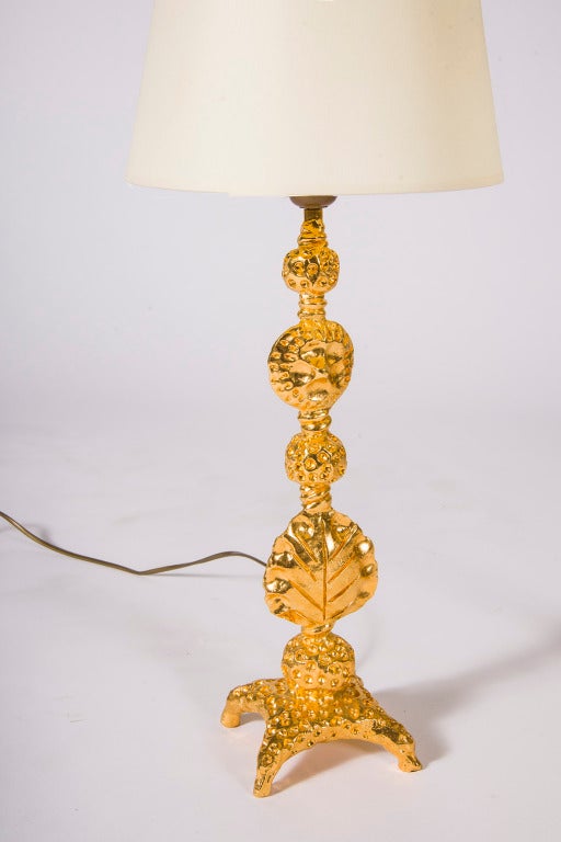 Pair of gilded bronze cast table lamps with leaf and anthropomorphic details attributed to Mathias Fondica. Priced per pair. Pointy shades included.