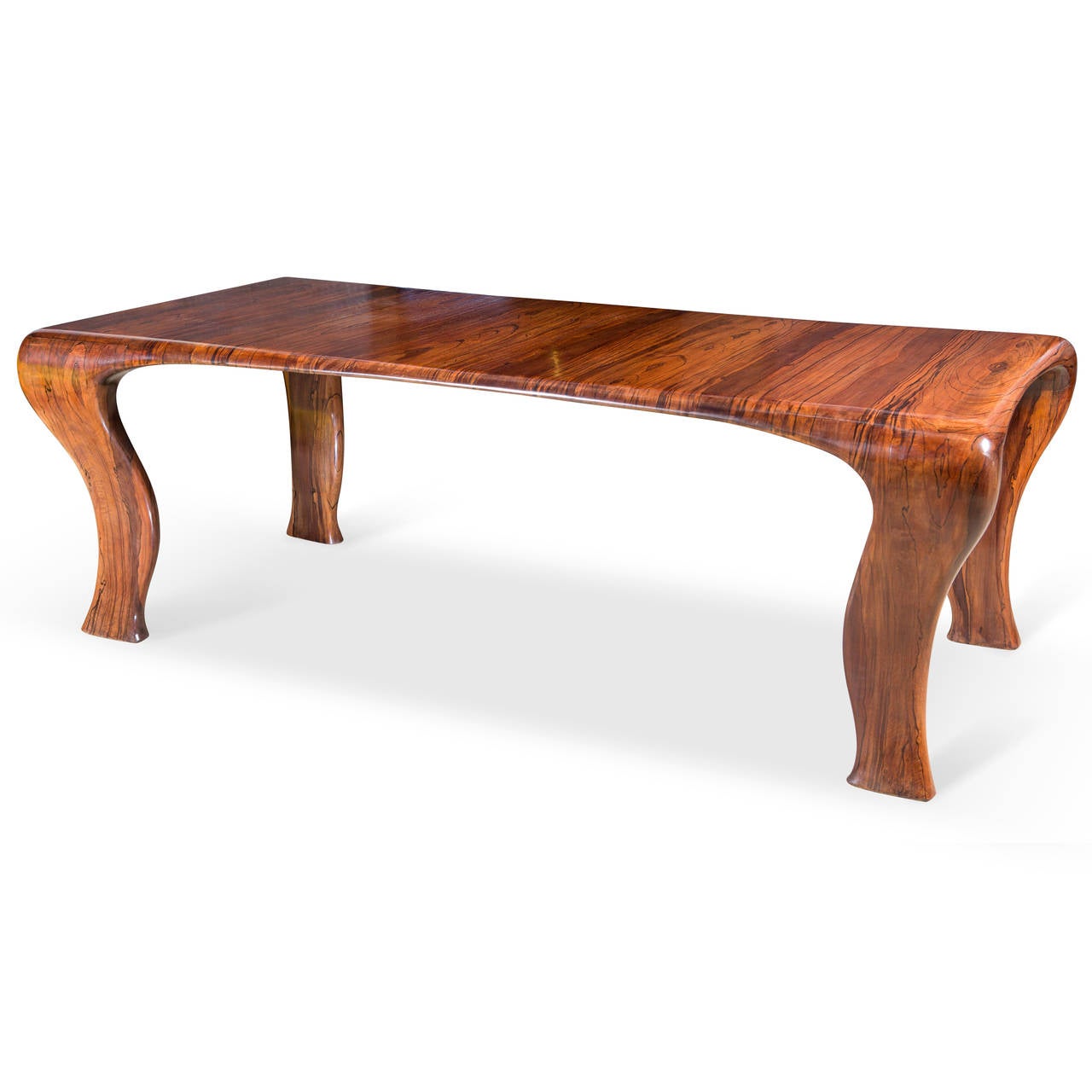 Solid iroko wood with curved sides and legs. Provenance: From a Danish private collection