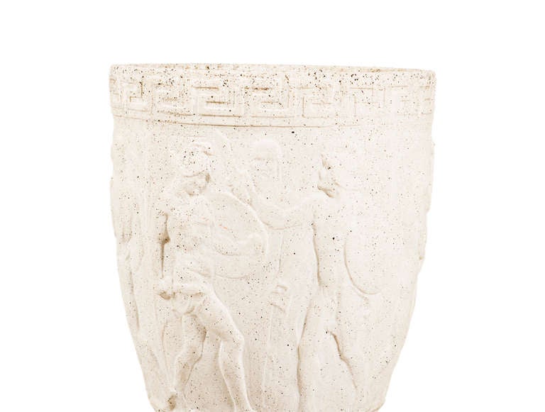 Limestone urns with art deco relief on raised stepped pedestal base.
