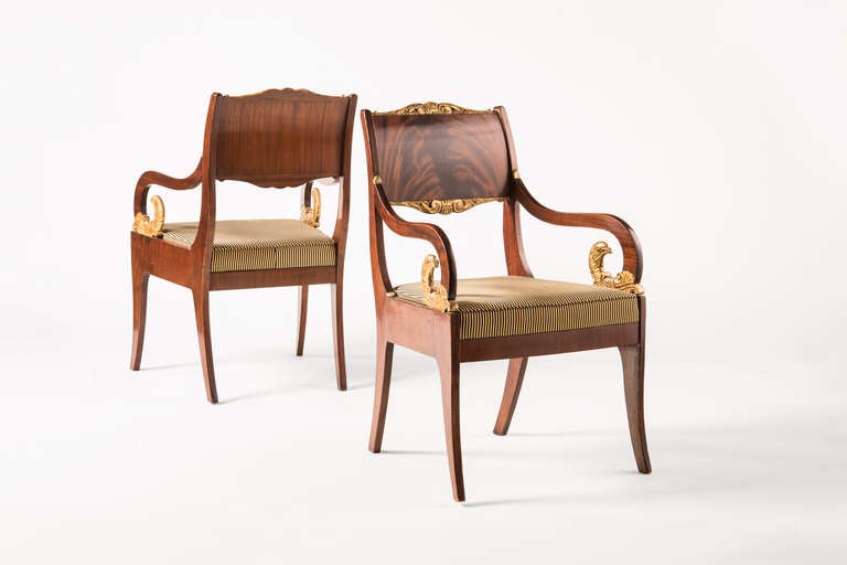 Pair of Russian Alexander armschairsin mahogany finish with avian gilded detail. Priced per pair.