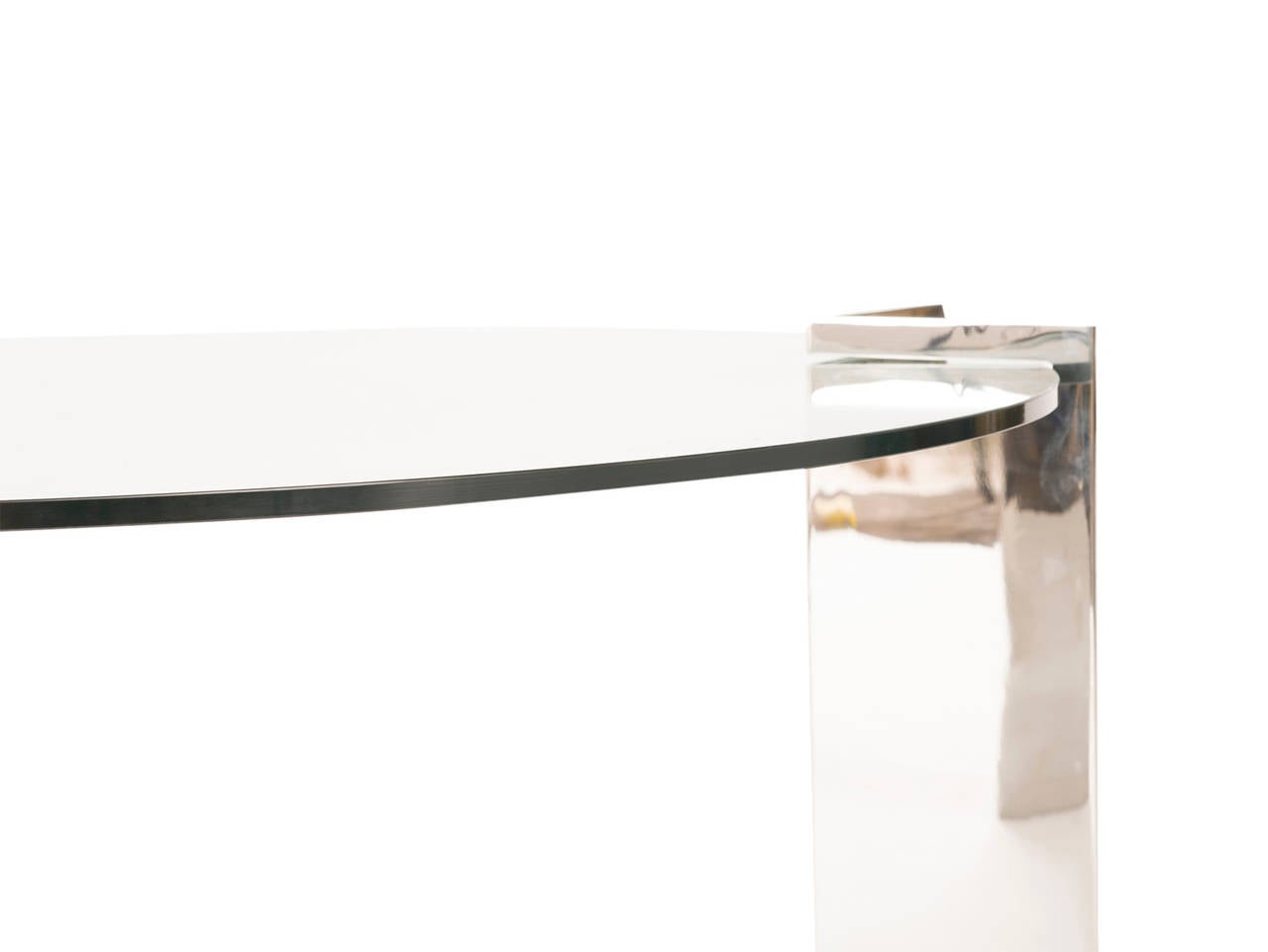 Polished mirrored stainless steel legs with smoked glass inset top.
