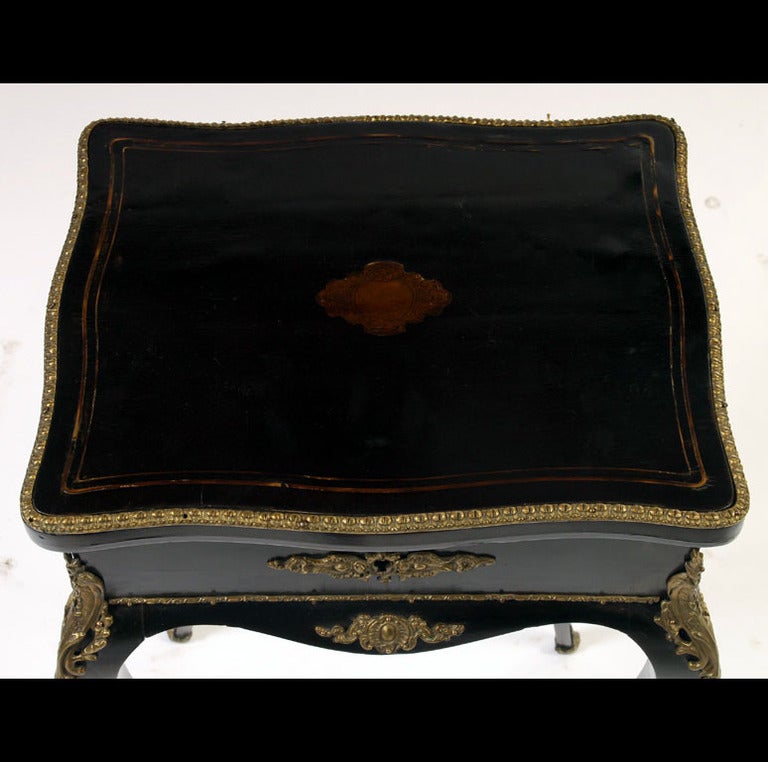 Napoleon III style ebonized and bronze mounted lift top side table
