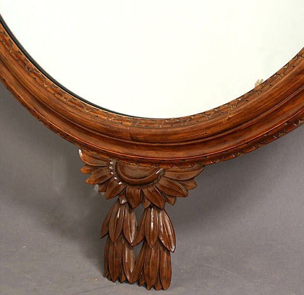 Hand-carved M. Grieve Co. mirror with trophe' carving.