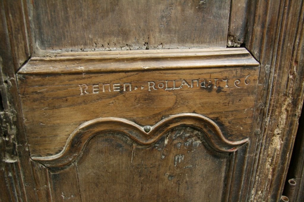 Pair of signed Reneil Rolland and dated 1706 armoire doors, French.