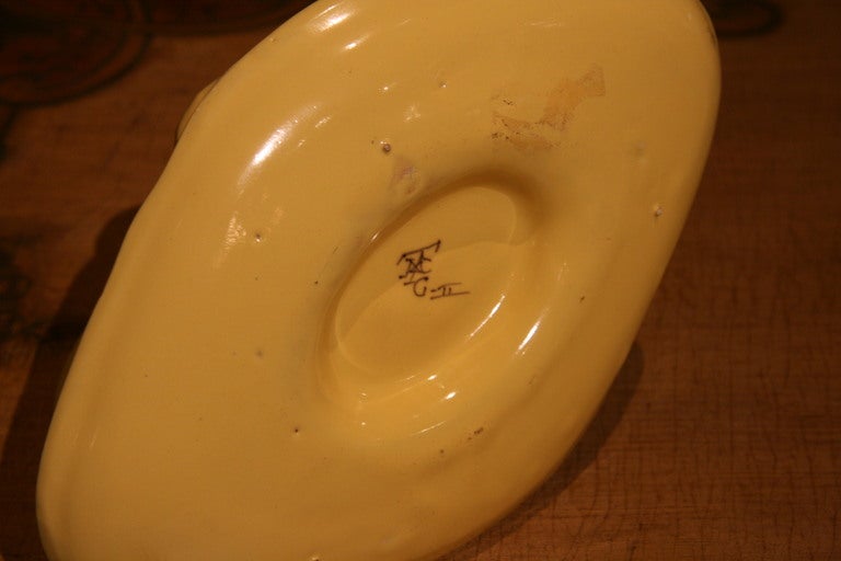 19th century, French, faience gravy boat with markings.