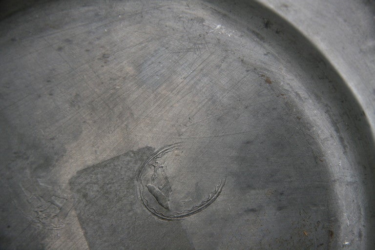 18th century pewter plate with marking.