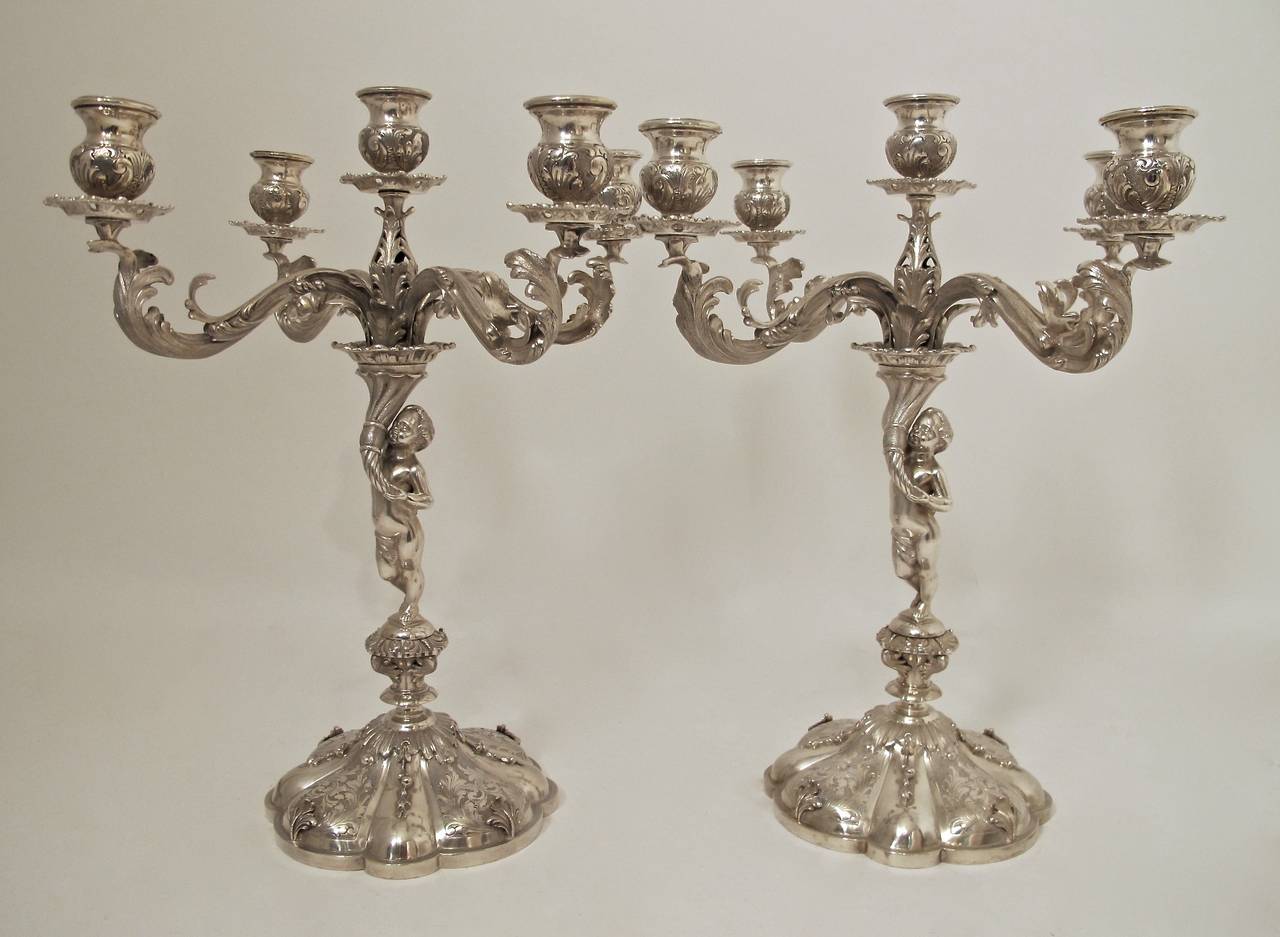 A fine and impressive pair of 800 silver five-light candelabrum, made by Bellini of Florence, Italy.