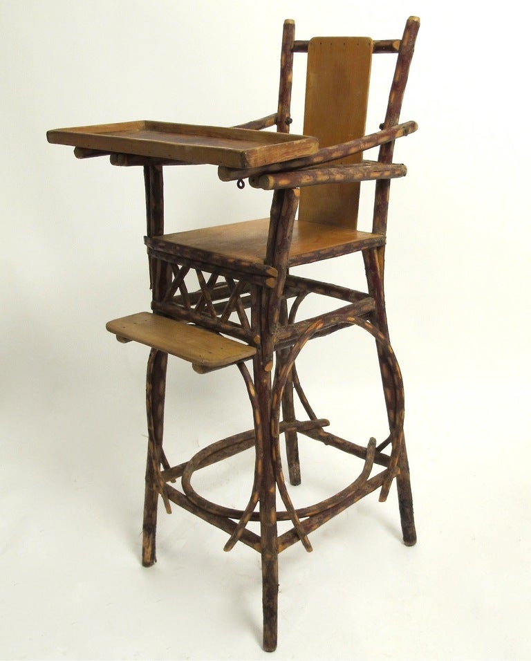 Unusual American Andirondak child's chair, circa 1910. Very good sturdy condition.