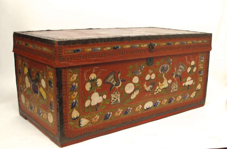 Camphor wood trunk covered in elaborately painted leather and trimmed with brass; probably made in the mid 19th in China for export. Inside is clean and overall condition is very good.  Figurative painting is done on three sides: back is painted