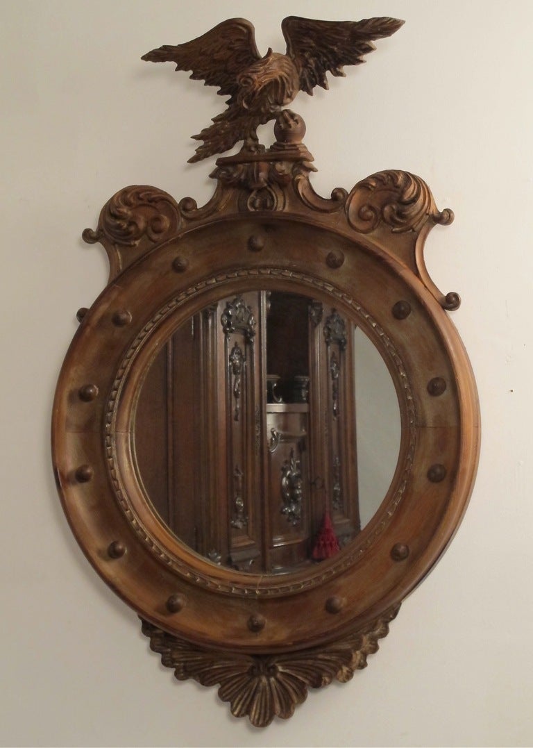 Hand carved and with unfinished wood that has a light stain. Italian, made in the 1950's. Mirror is not convex.