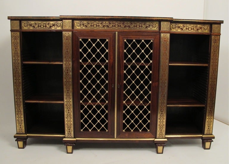 A spectacular English Regency period side cabinet, bookcase or credenza, of rosewood with elaborate brass inlay and brass grate from doors. Attributed to Gillows of Lancaster & London.
Exceptional quality and craftsmanship.
England, early 19th