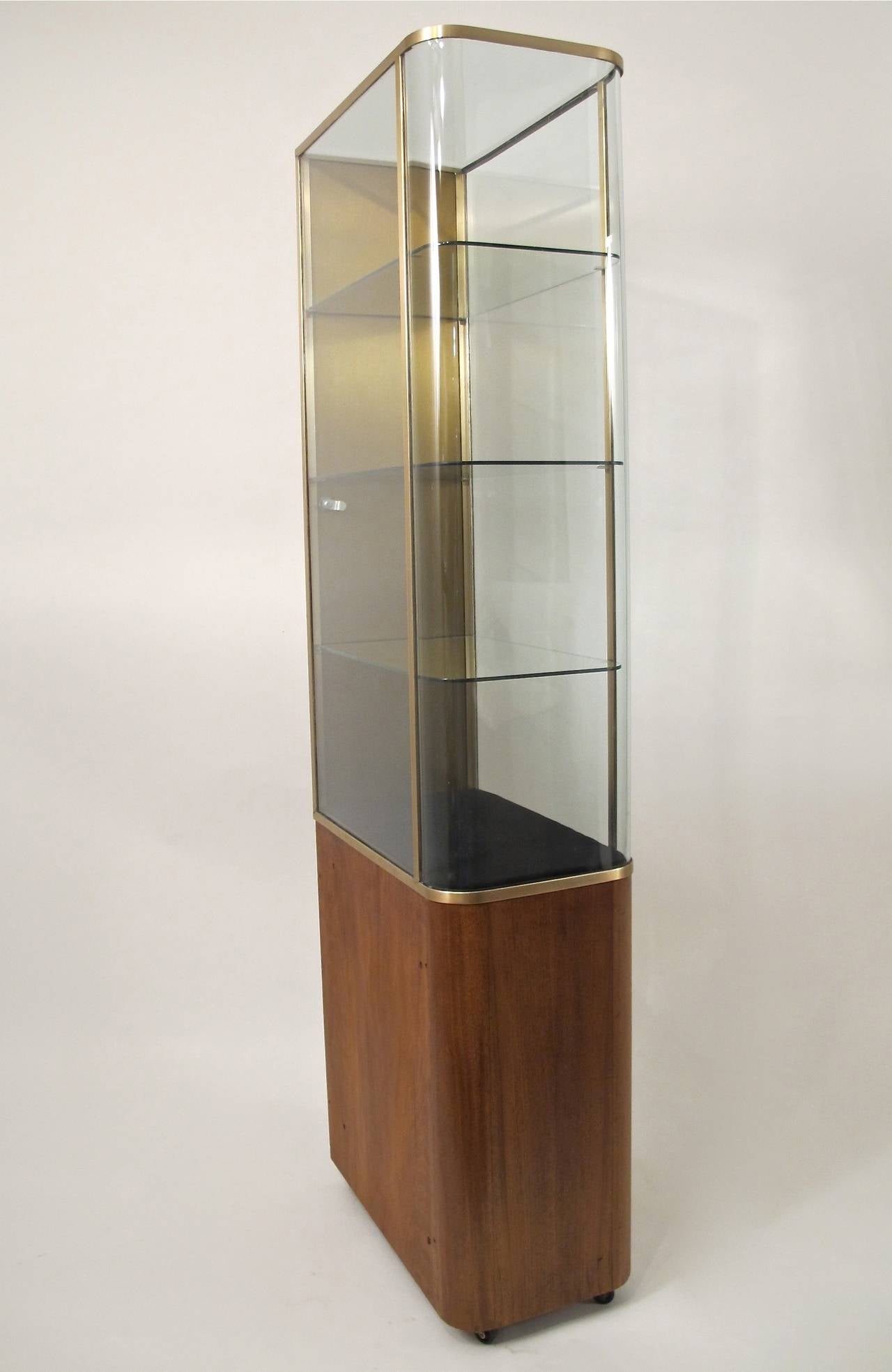 Recently refurbished pair of display cases originally for Parker Pens. Each having three glass shelves, polished brass trim and working locks.