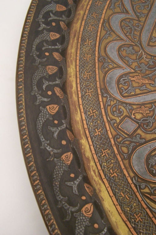 This is an extraordinary tray with great detail. Made of mixed metals; copper, silver and brass. A nice large size.