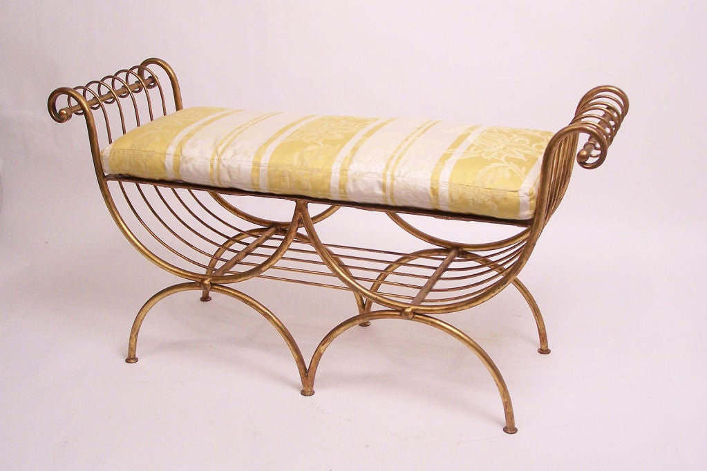 Nice size Italian gilt metal bench with newly upholstered cushion.