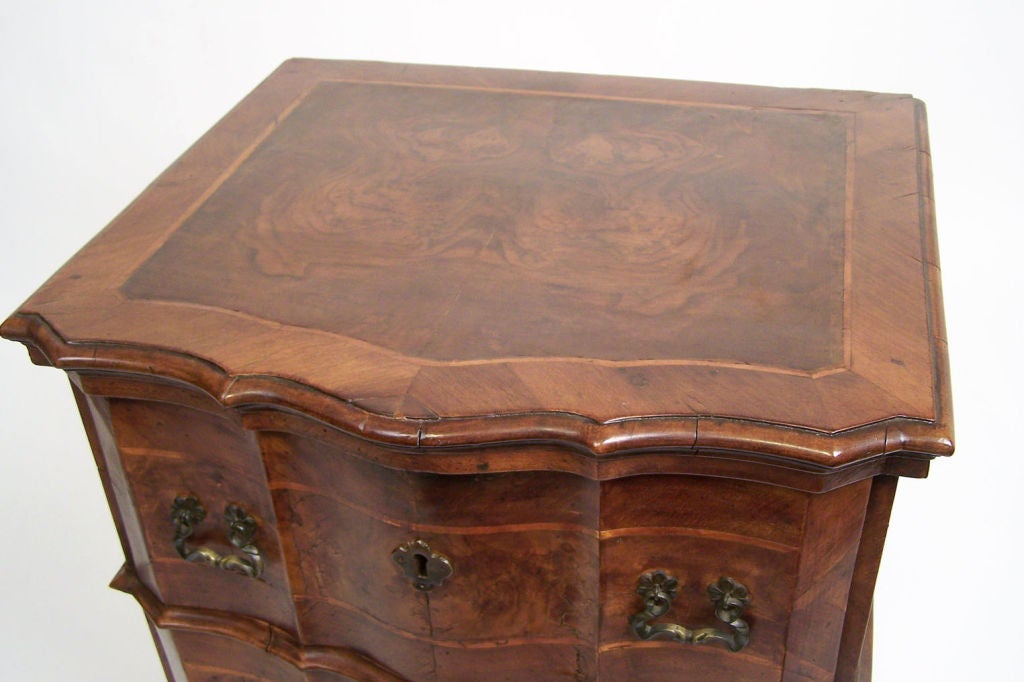 Exceptional Baroque style three drawer walnut chest with inlaid detail. Italy, late 17th century/early 18th century.
