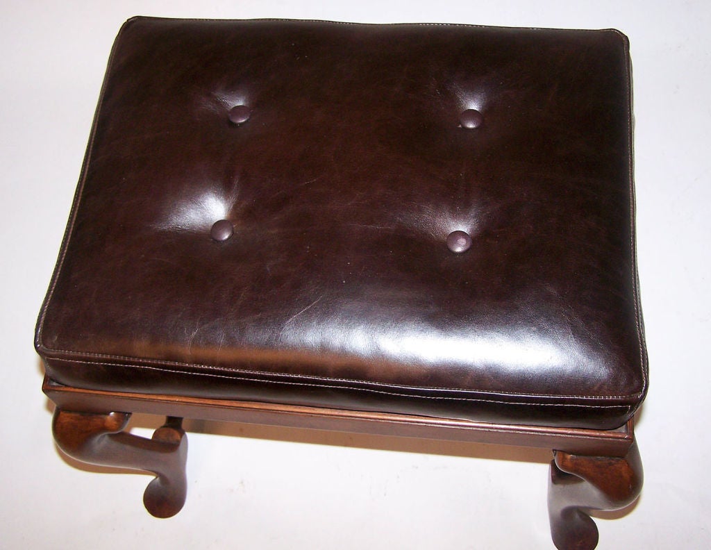 English walnut footstool or bench with deep dark brown leather cushion. Extremely good quality, custom made bench. England, late 19th to early 20th century.