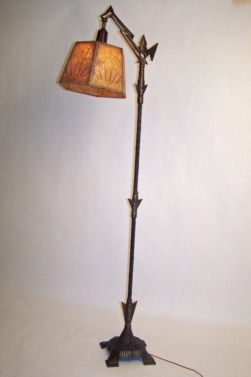 Extreme Art Deco floor lamp with original two tone mica shade. Silvered cast iron and steel base. Recently re-wired and reconditioned.