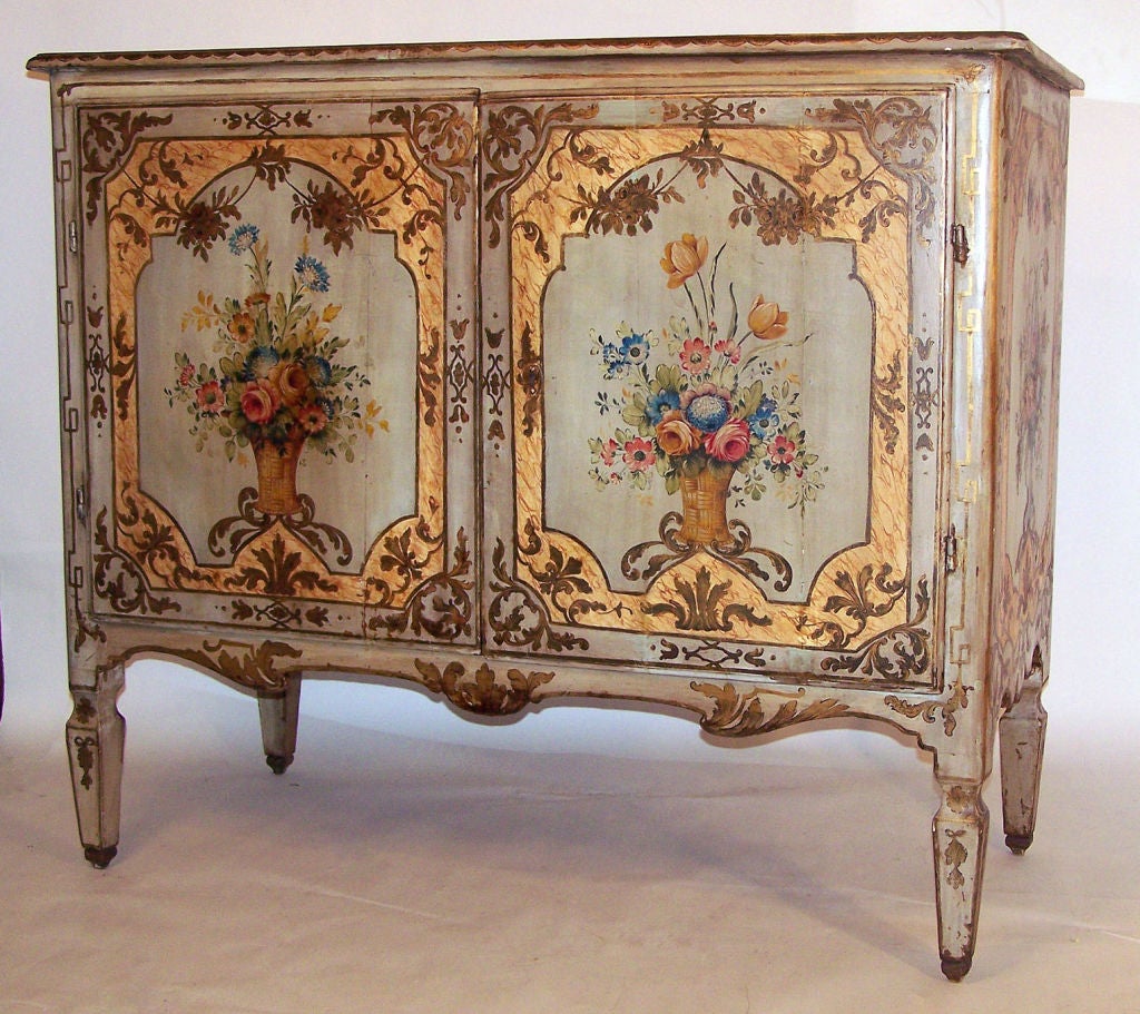 An exceptional 18th century large scale painted two door buffet. The paint is old but probably not original, most likely painted in the late 19th century. Have original hand wrought hardware.