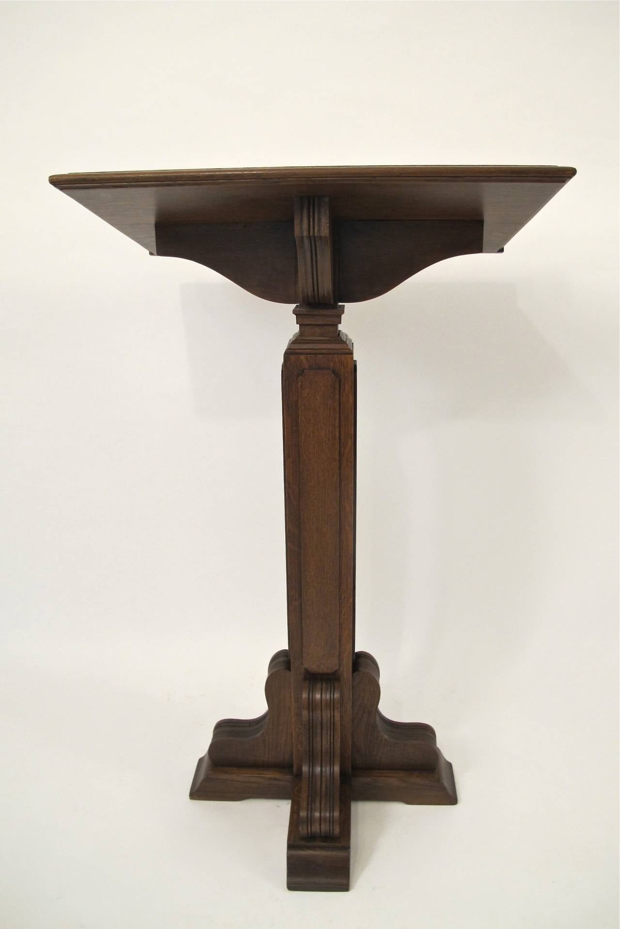 Adjustable oak lectern, adjusts to a maximum height of fifty inches.