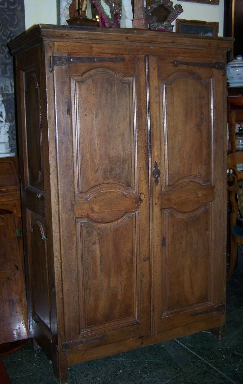 Unusual small size solid oak armoire or cabinet. All original hand wrought hardware and old but not original finish. Custom made fitted interior done in the 1980's. 
France, early 18th century.