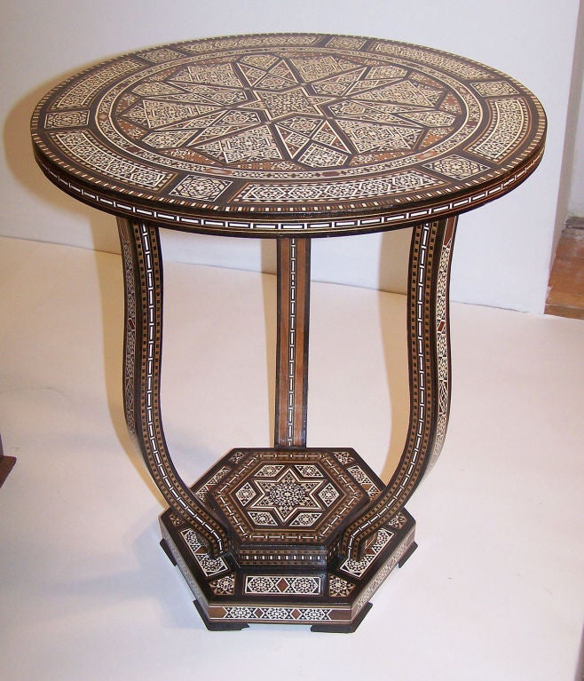 Elaborately inlaid side table.