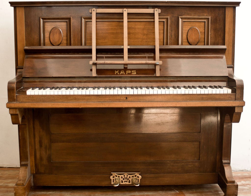 Very fine Ernst Kaps German Art Nouveau walnut upright piano with original brass details. Provenance - Estate sale Paris. History:Established in 1858 like Bechstein Kaps adopted the modern<br />
technology of the time from the beginning. Kaps was