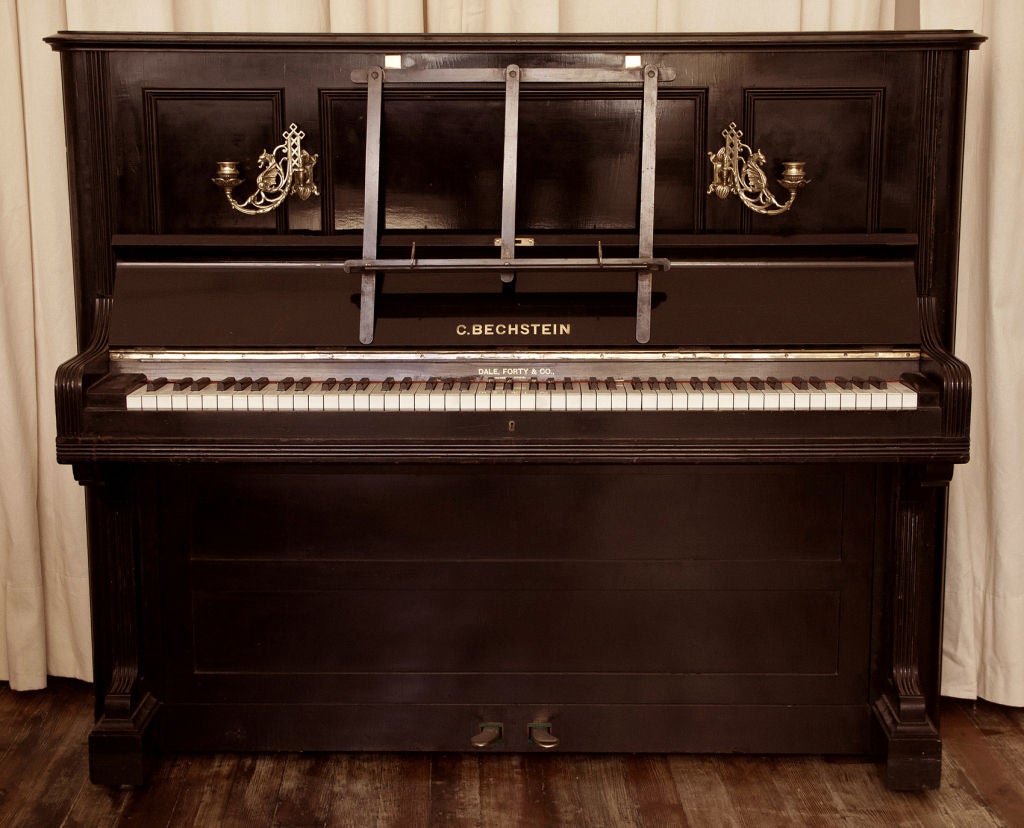 A very rare Bechstein upright piano with original brass candle holders. Private collection London. History:<br />
Bechstein of Berlin has been called the serious pianists maker.Aside<br />
from the superb musical attributes of his pianos Bechstein