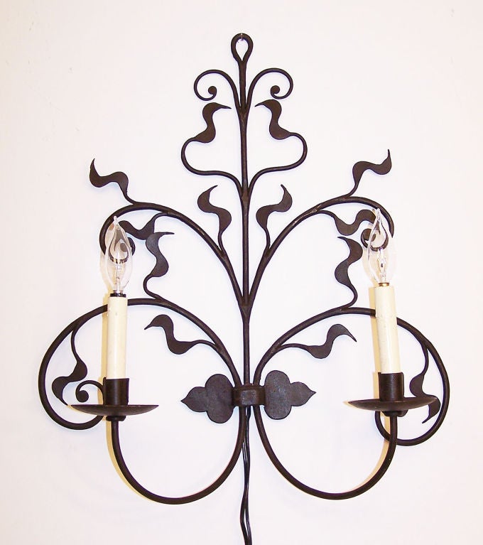 Beautiful pair of hand wrought Art Nouveau style wall lights.