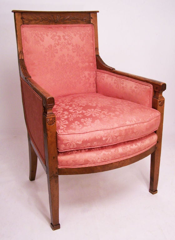 Neoclassical style walnut armchair with hand carved detail. Beautiful rich patina on the wood. Upholstery is in good vintage condition.
Chair is sturdy and structurally sound.
France, late 18th century.