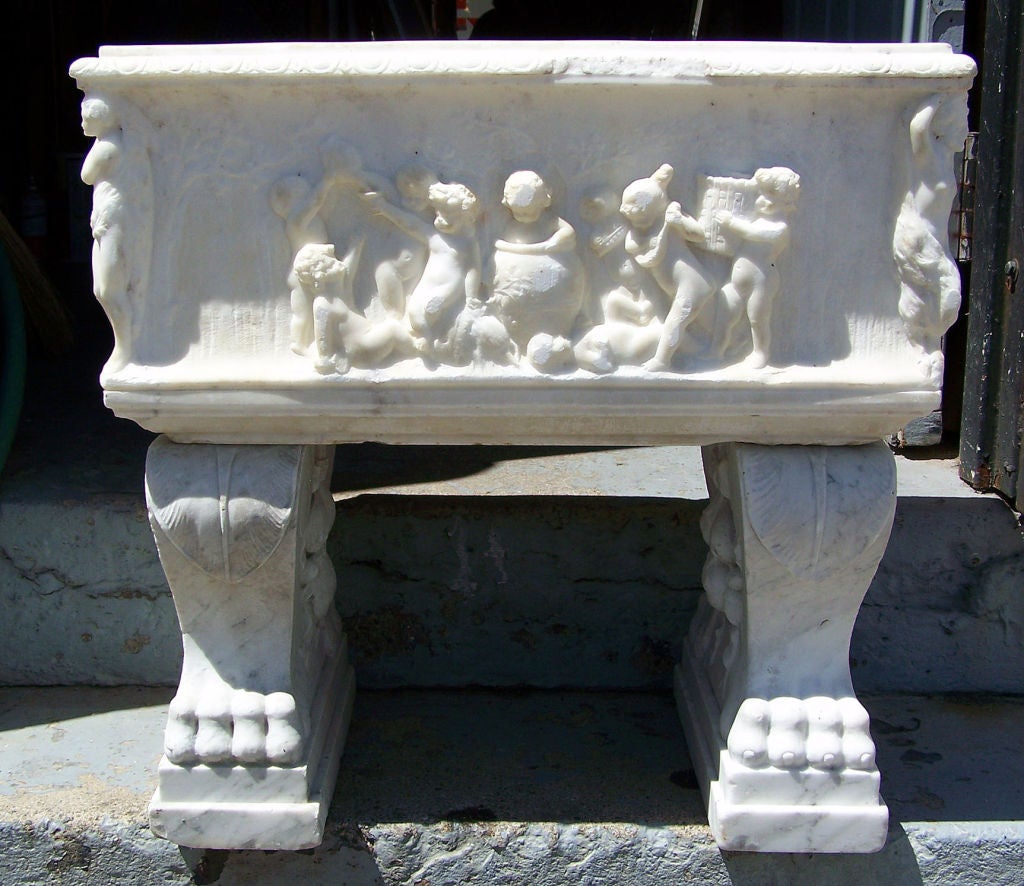 Renaissance style Italian hand carved carrera marble planter on original stand.  Italy, late 19th century.