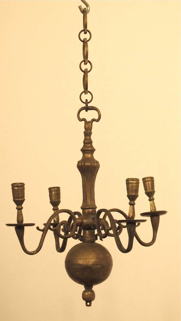 An early 17th century solid brass Dutch or Dutch colonial small candle light fixture in original condition.