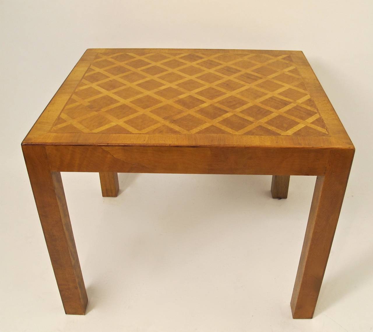 Inlaid walnut and olive wood parsons side table with lattice pattern top, and quarter round walnut inlay on the top and leg edges. Has fitted glass top. Italian, circa 1970's.