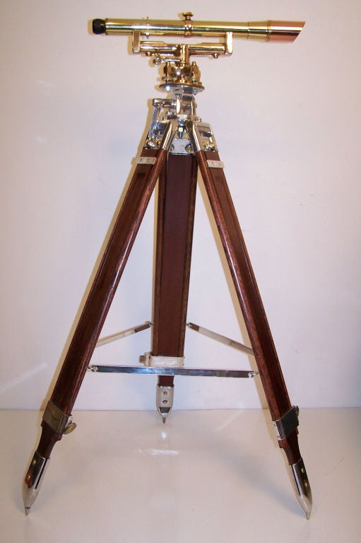 Bronze surveyor's transit mounted on wood stand. Fully restored. Made by Keuffel & Esser Co.