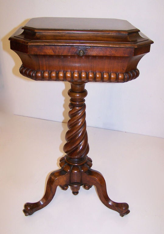 A 19thC English fruitwood and burled walnut teapoy with green silk velvet interior lining (missing the original glass mixing bowl).