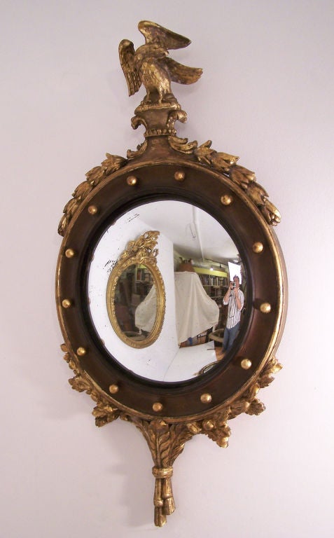 A Federal style carved and gilt wood frame with convex mirror (old if not original mirror).
