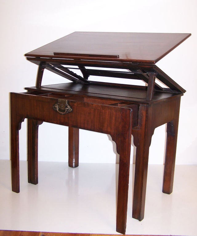 English draftsman or architects table. Mahogany veneer over solid mahogany (no secondary woods). Measurements are the table size when closed.