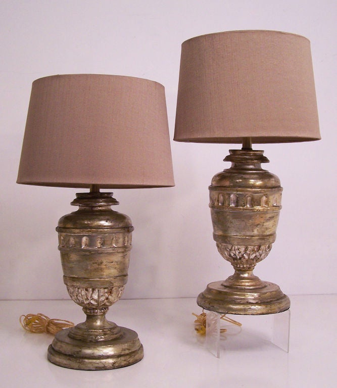 Hand carved and silver gilt wood urns converted to lamps. Newly re-wired. Shades not included. European, late 18th to early 19th century.