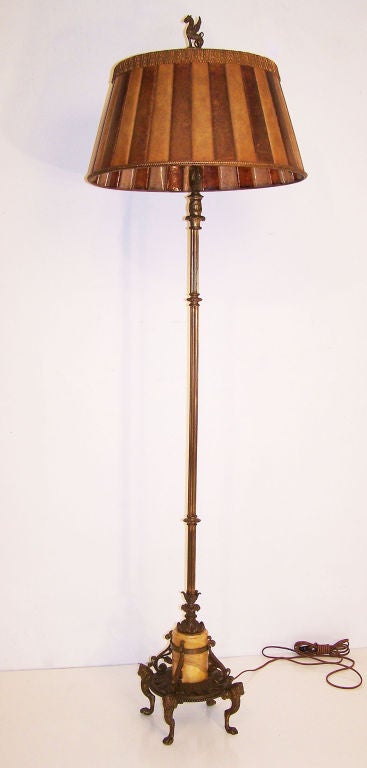 Exceptional bronze floor lamp with period antique mica shade.