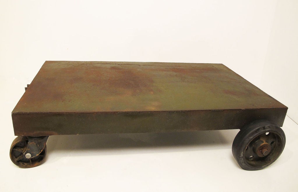 Welded iron cart handmade early to mid 20th century. Remnants of original green paint with some expected rust.