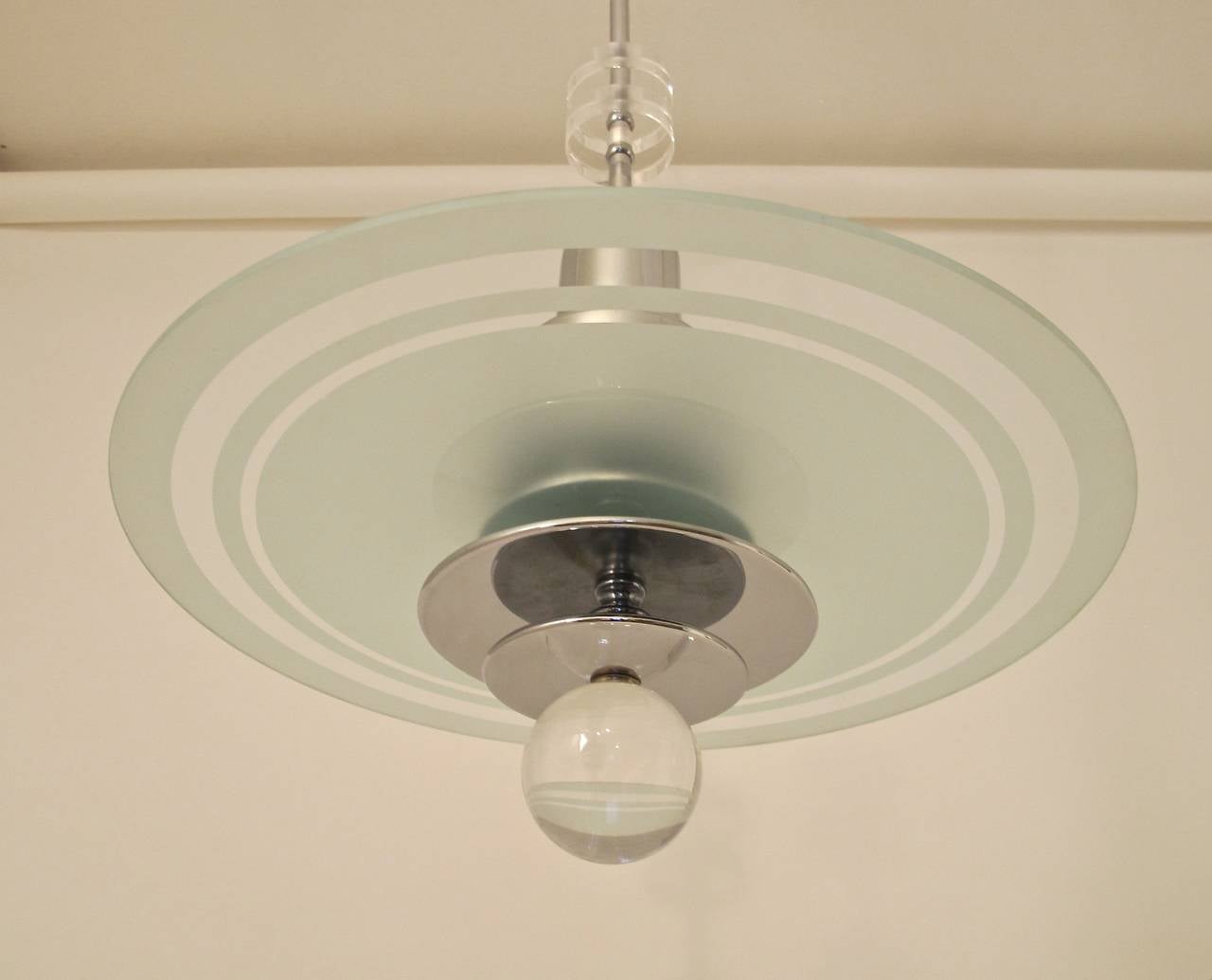 Streamline modern style chrome plated steel ceiling light with glass shade and lucite accents. High quality craftsmanship, custom made in the late 20th century (1980's) based on an American fixture from the 1930's - 1940's. We have 6 fixtures