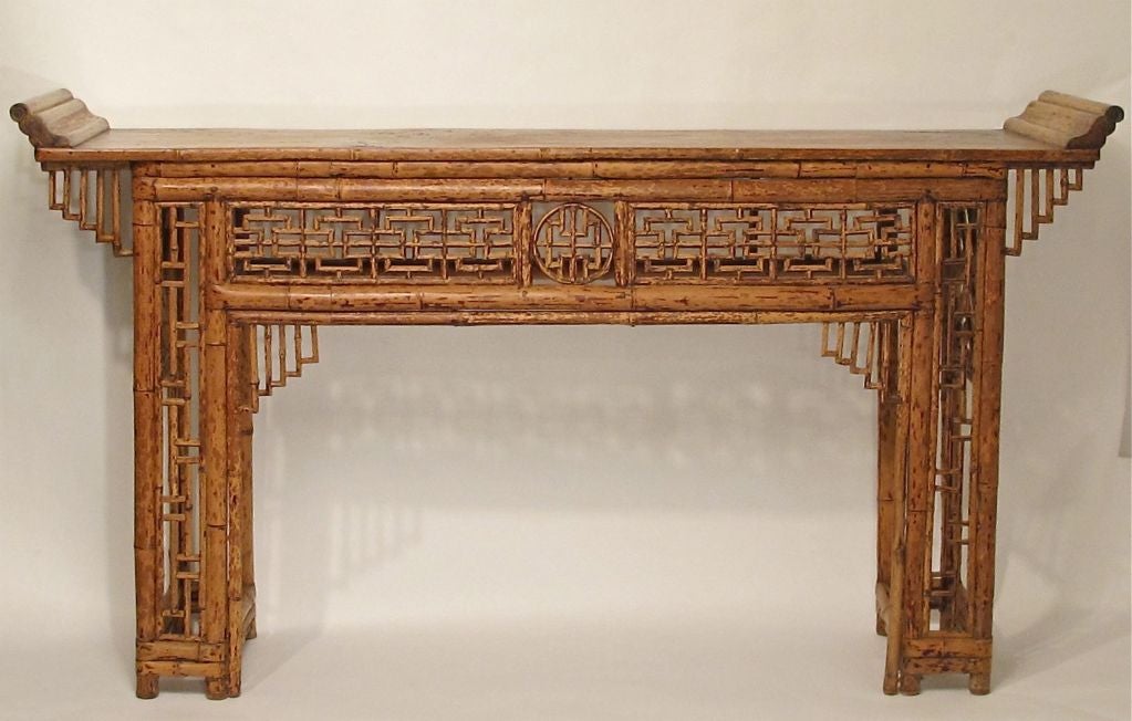 Elegant bamboo altar table with fine lattice and fret work.