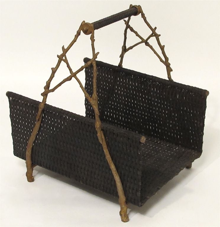 Japanese influenced, woven and cast metal log holder. Wonderful faux bois twig detail on the sides.