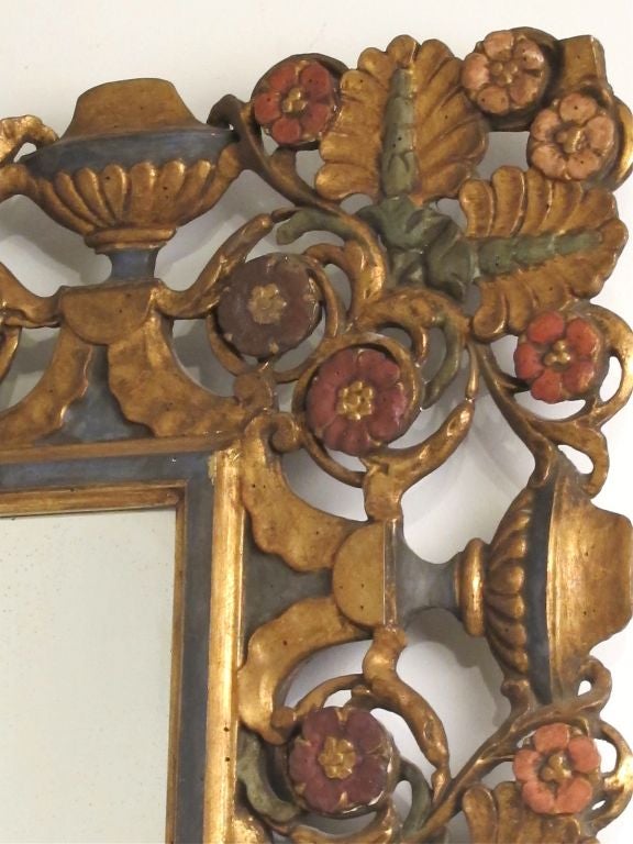 Beautifully carved walnut mirror with original paint. Can hang vertical or horizontal. Italy, early 20th century.