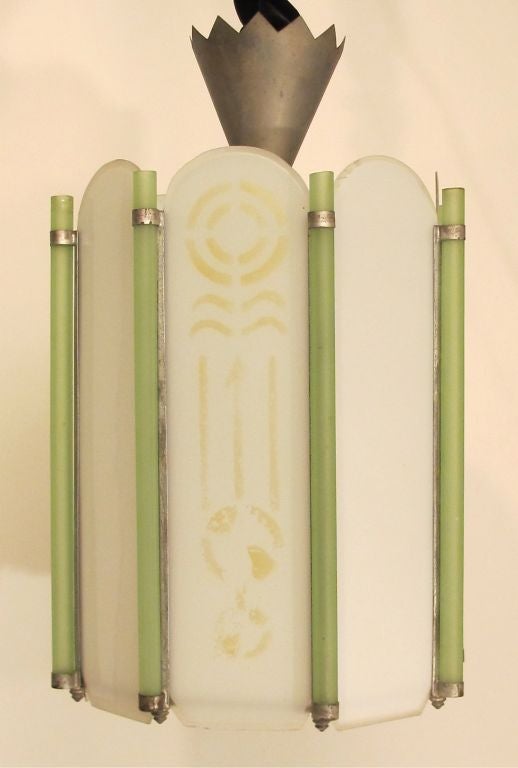 Octagonal Art Deco light fixture with frosted beveled and etched panels seperated by green glass rods and nickel-plated hardware. American, circa 1925. Recently rewired.
  