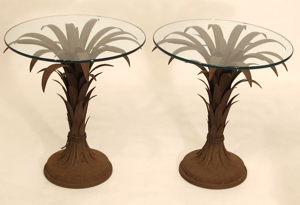 An attractive pair of vintage end or side tables. Beautifully aged and oxidized metal (surface rust) with glass tops, Italy, mid-20th century.