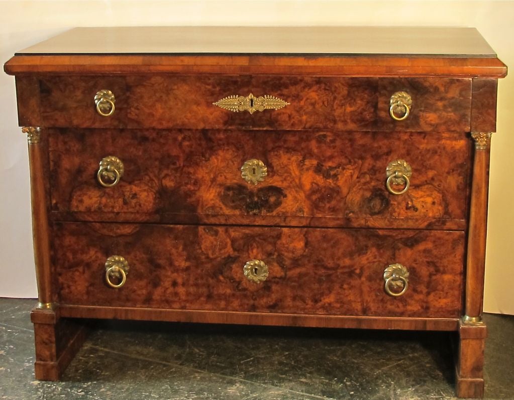A large-scale Italian Empire period three drawer chest with beautiful figural walnut veneers, and having original gilt bronze hardware. Excellent antique condition with some recent refreshing.
One of a pair, sold separately.
Italy, 19th century.